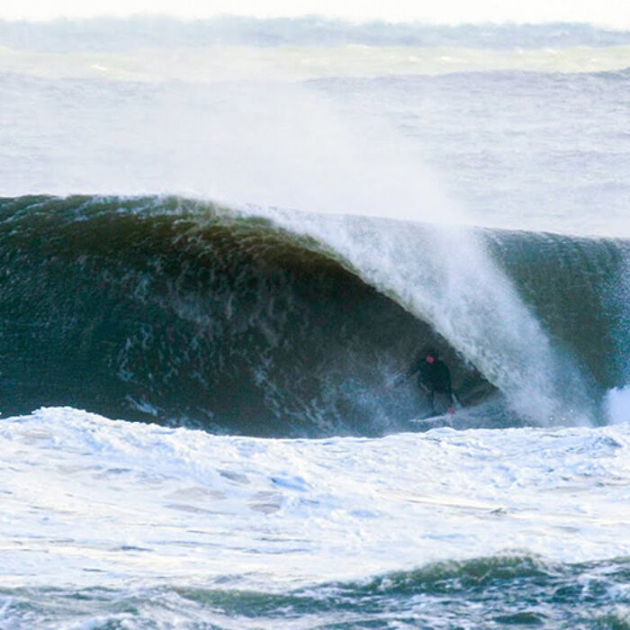 Surfer Brett Barley in a barrel in the Outer Banks