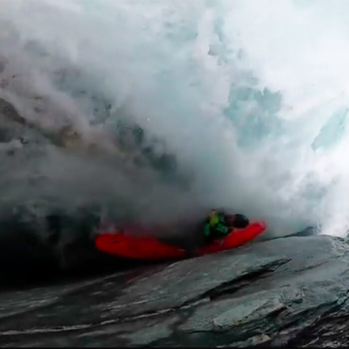 A whitewater kayaker gets caught in a sieve on a river in New Zealand