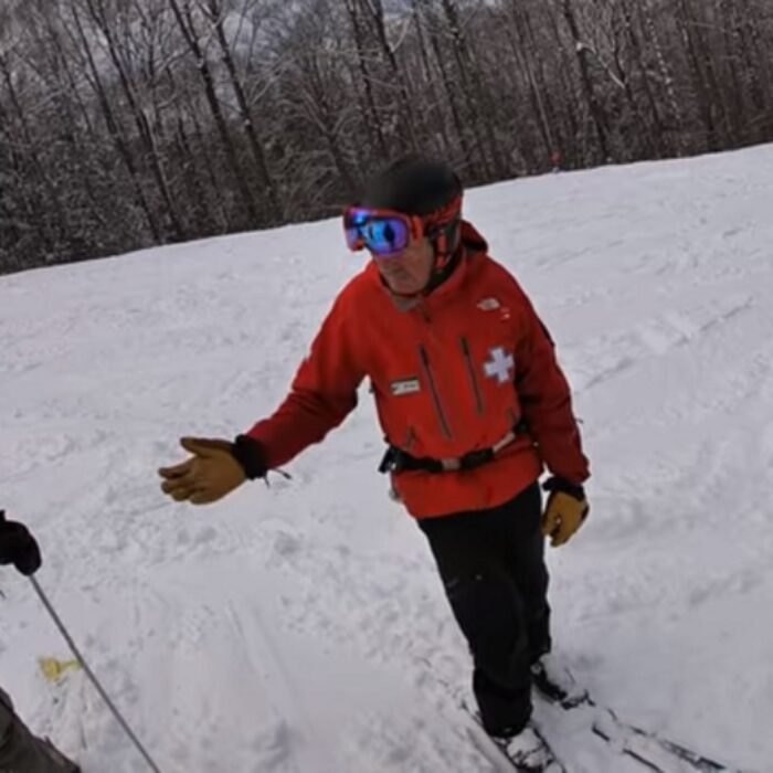 ski patrol pulls passes for out of bounds skiing at loon mountain