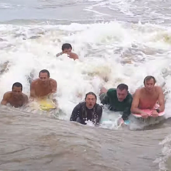 Jamie O'Brien and others surfing the Waimea River wave