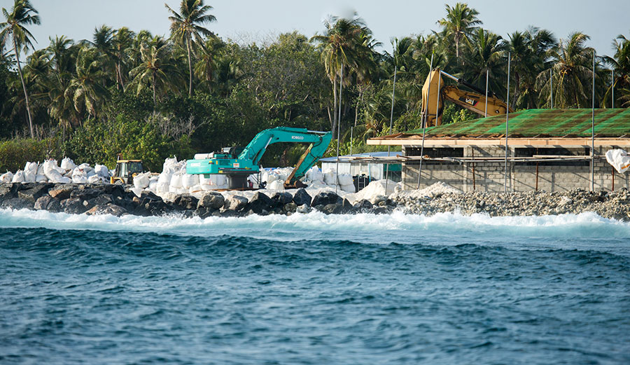 View of an excavator from a surfing lineup