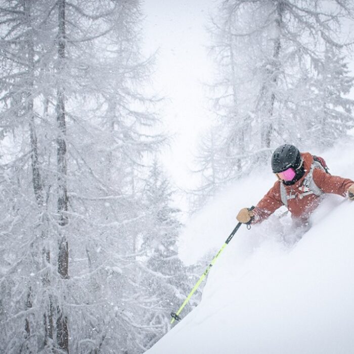alex lange via unsplash powder skiing deep