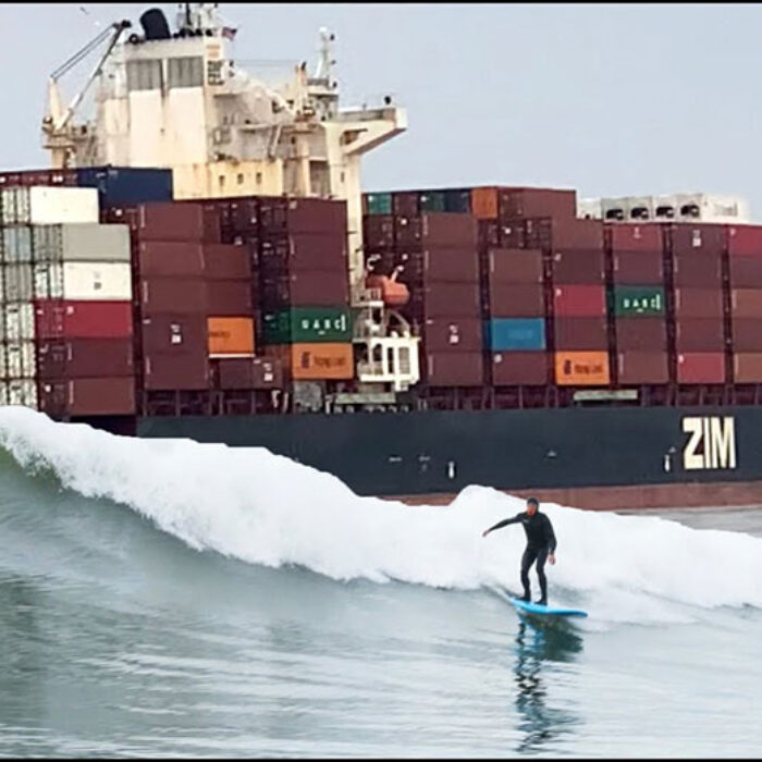 Ben Gravy surfing wave from tanker ship
