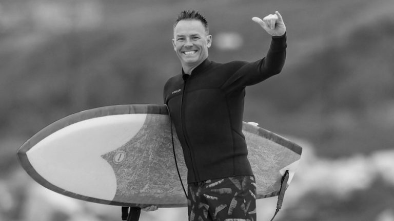 World Surf League CEO Erik Logan goes for a surf