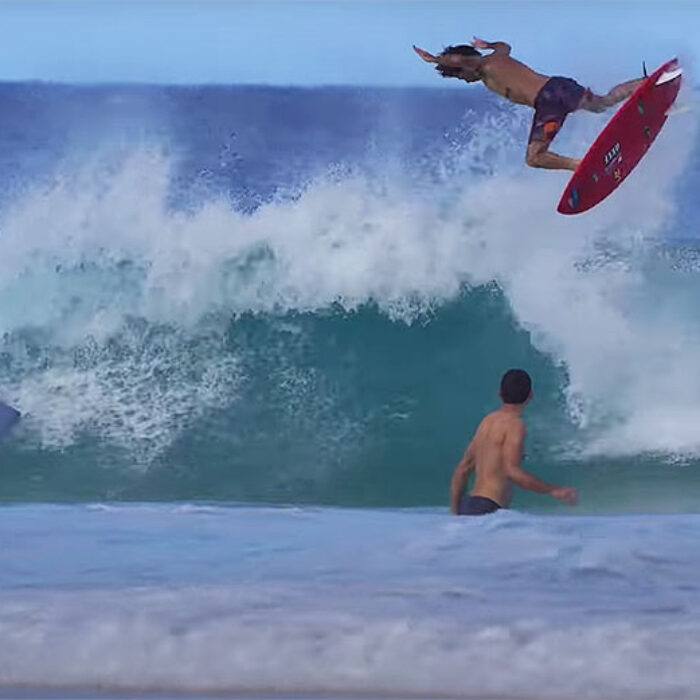 Mason Ho surfing at Ehukai Beach Park