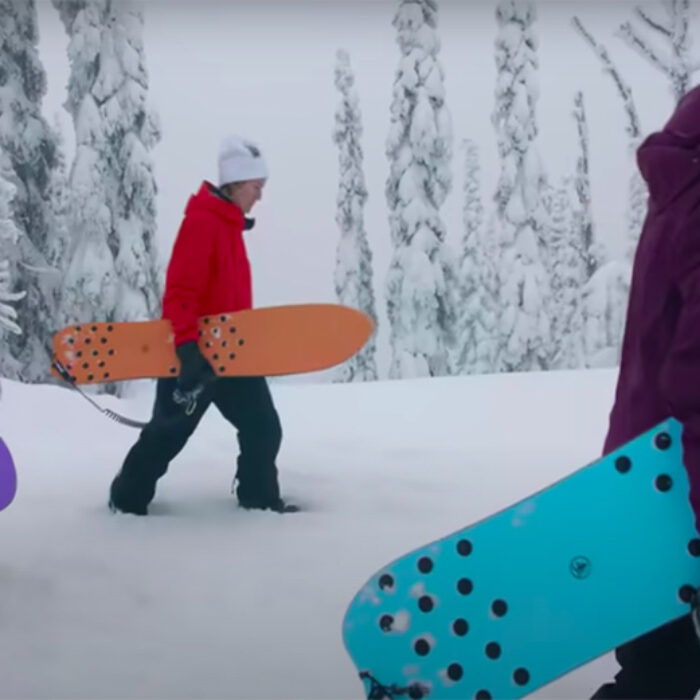 Danny Davis and Red Gerard walk with pow surfers