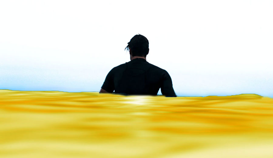 Man sitting in yellow water