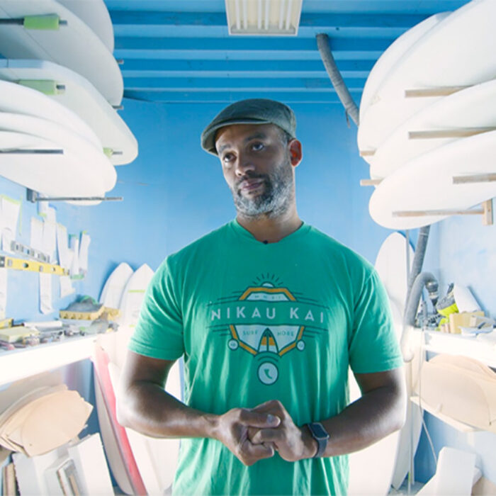 Ryan Harris stands in his shaping bay at Earth Technologies