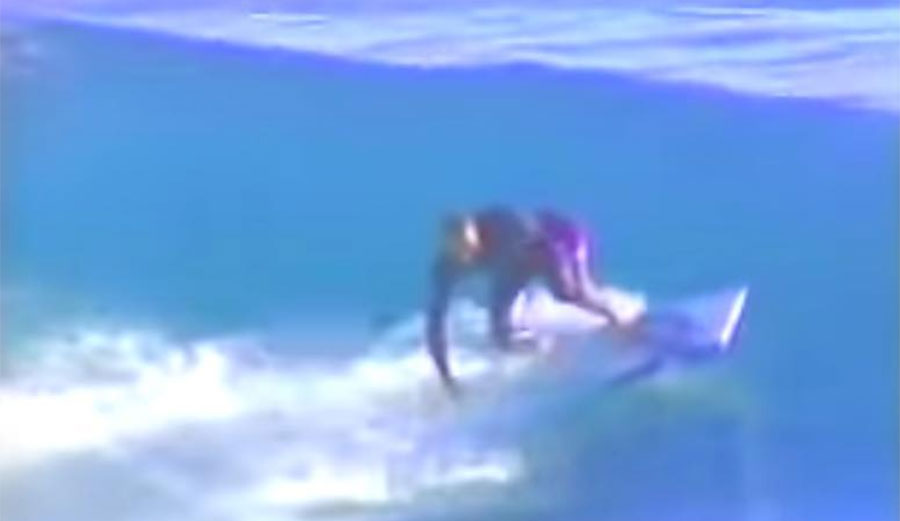 Todd Chesser on broken surfboard