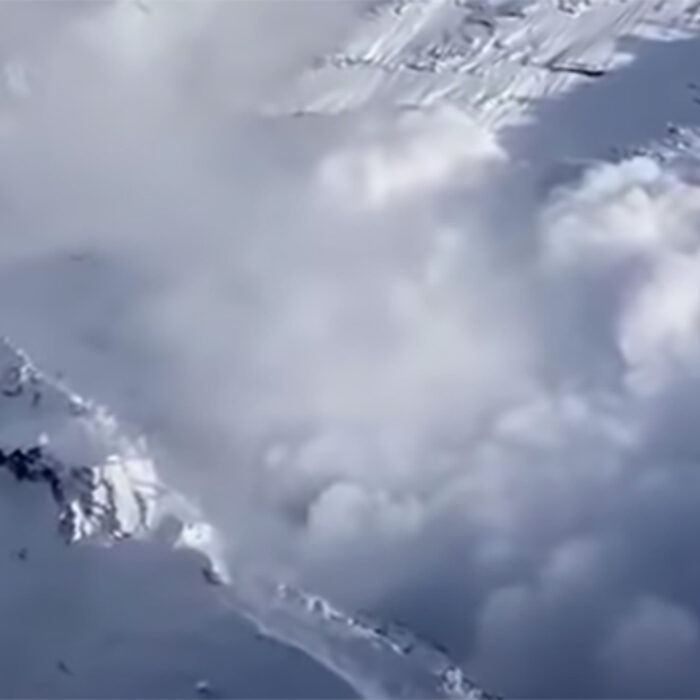 a giant avalanche careens down a canyon in Utah
