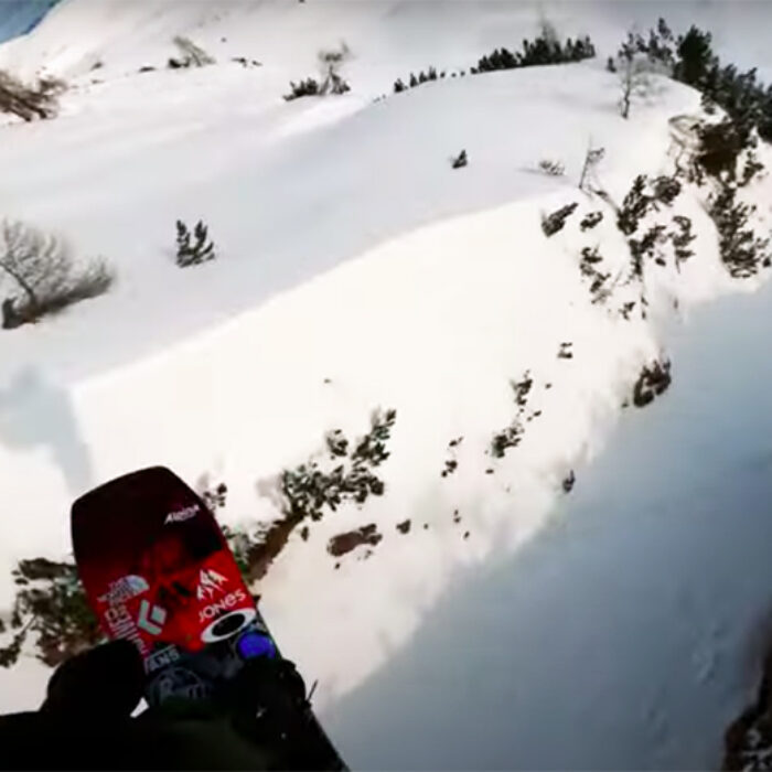 Snowboarder Victor de Le Rue hits a gap during a Freeride World Tour event