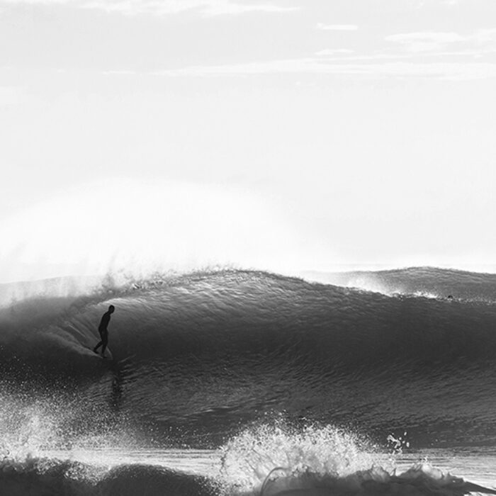 A surfer gets barreled at Pipeline