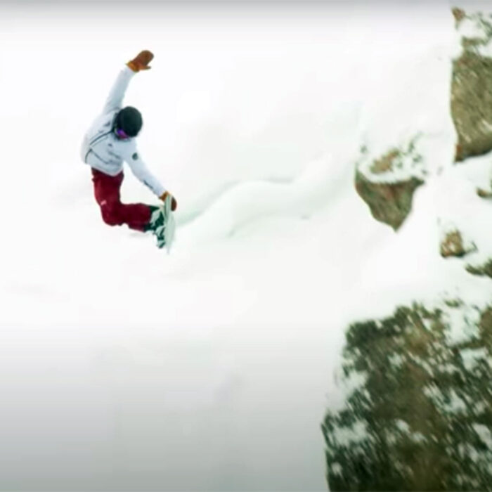 A snowboarder throws a method off Corbet's at Jackson Hole