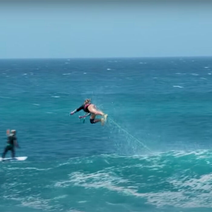 A kite surfer wipes out hard on a wave