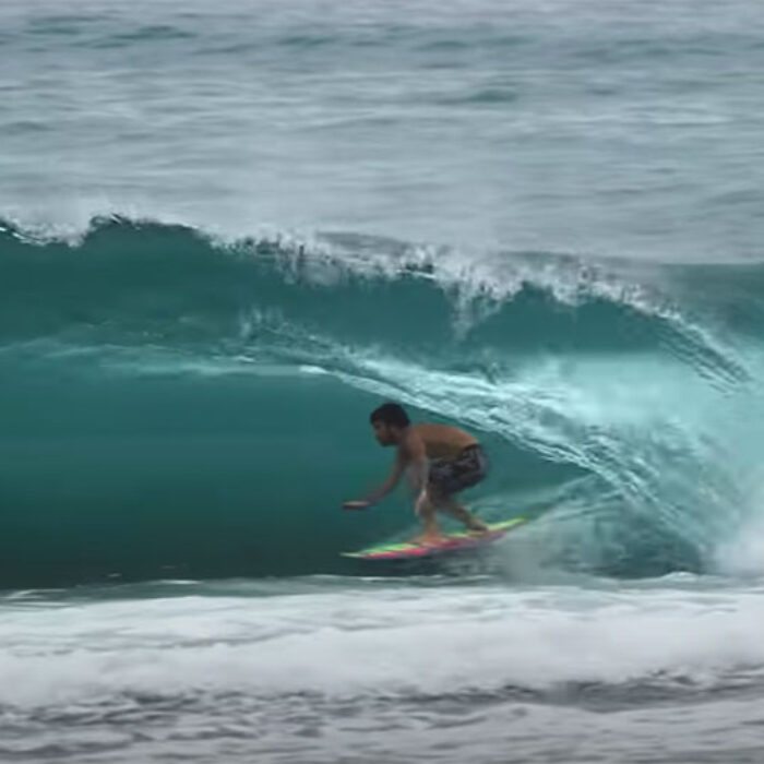 Mason Ho surfing in barrels on reef