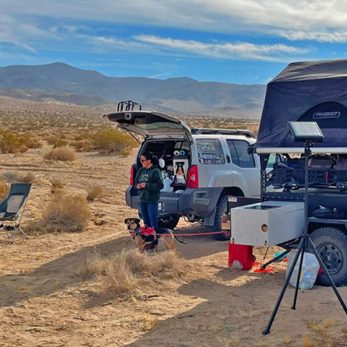 A nomadic couple and their camping setup