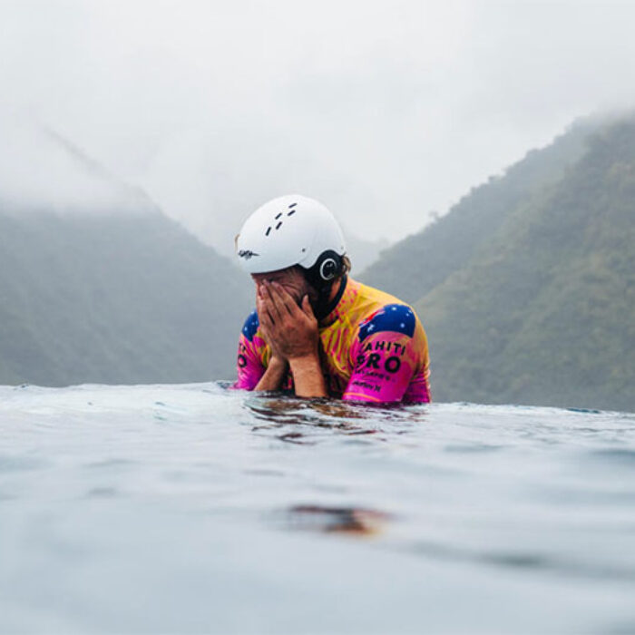 Owen Wright surfing in Teahupoo with helmet on