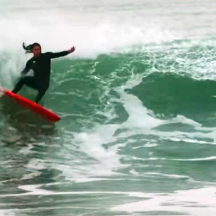 Darhsan Gooch makes a turn on a wave
