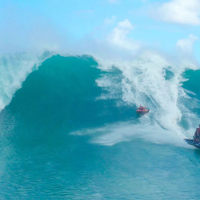 Jamie O'Brien on big wave with inflatable raft