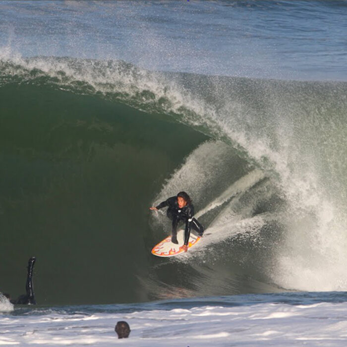 A surfer in a barrel at El Porto