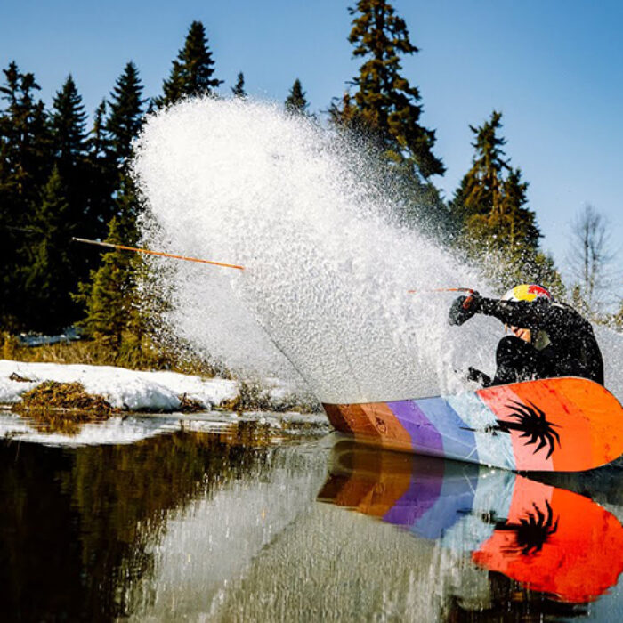 Nikolas Plytas using a snowboard to wakeboard