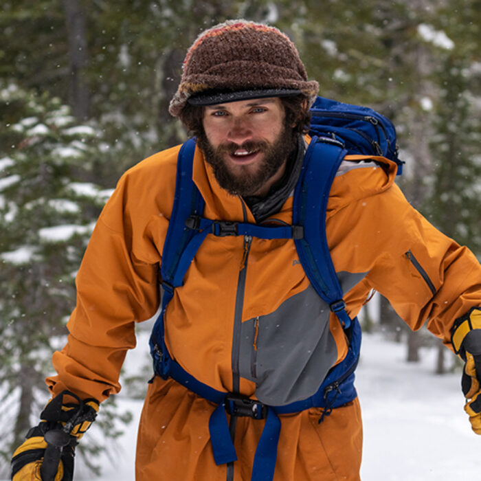 Nick Russell hikes on his splitboard in the backcountry