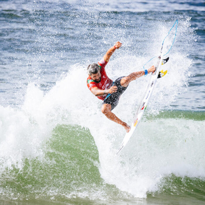 Italo Ferreira goes to the air on a wave in Newcastle, NSW, Australia