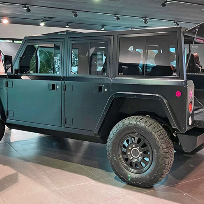 A 4x4 electric SUV on the showroom floor