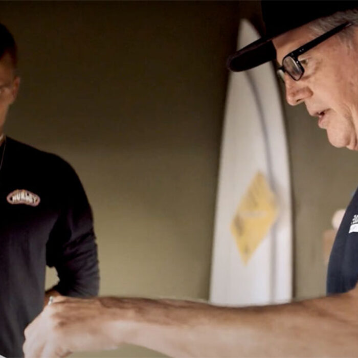 Jon Pyzel making surfboard with Koa Smith