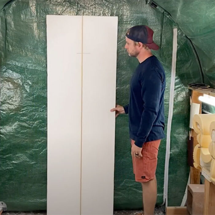 shaping a surfboard