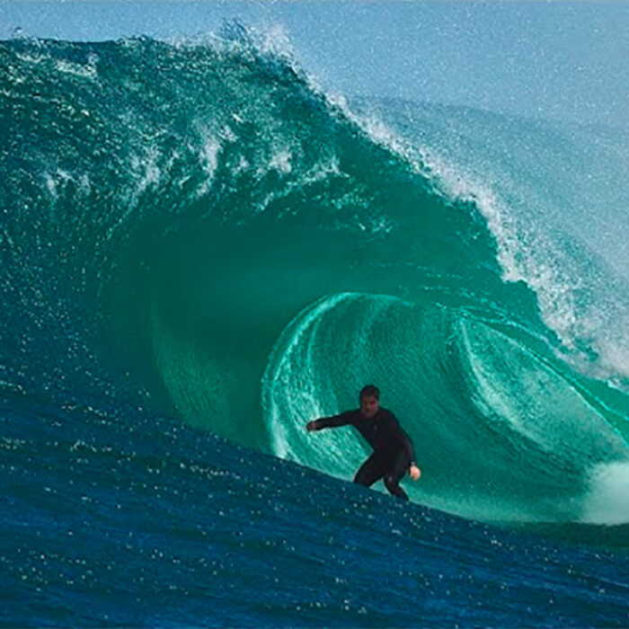 A surfer rides a dangerous barrel in Australia