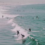 surfers at venice beach unsplash victoria palacios