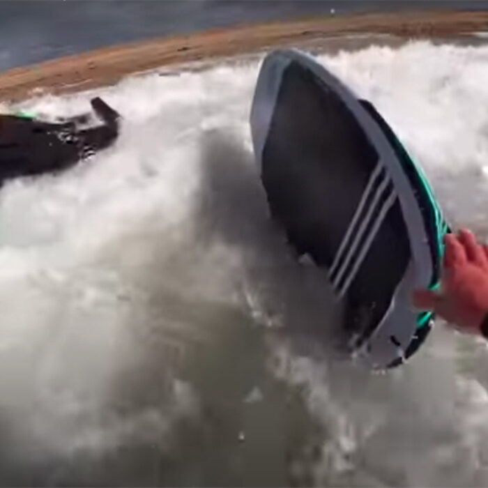 A wing foiler gets beat down in the shorebreak