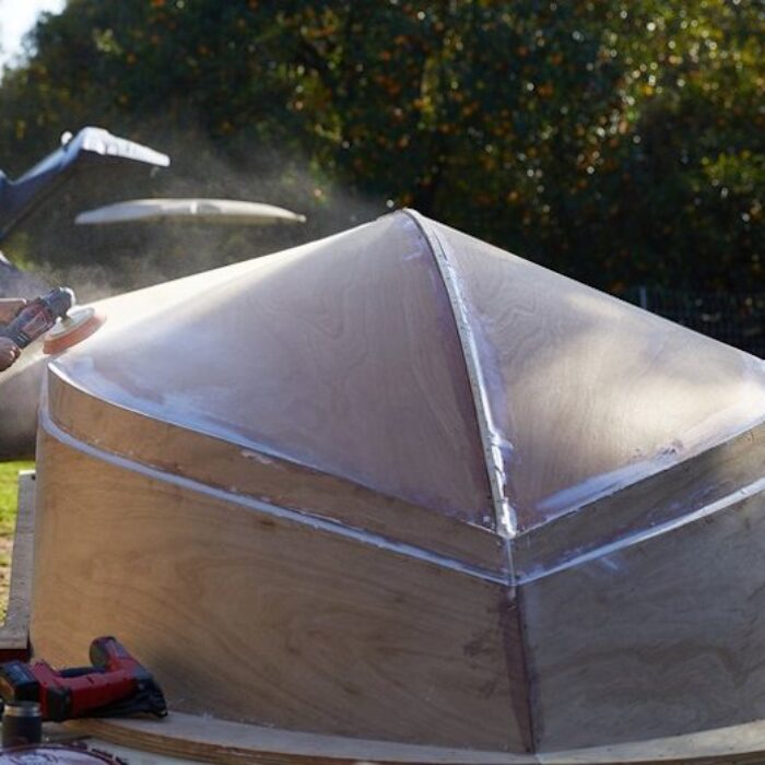jay nelson sanding a boat