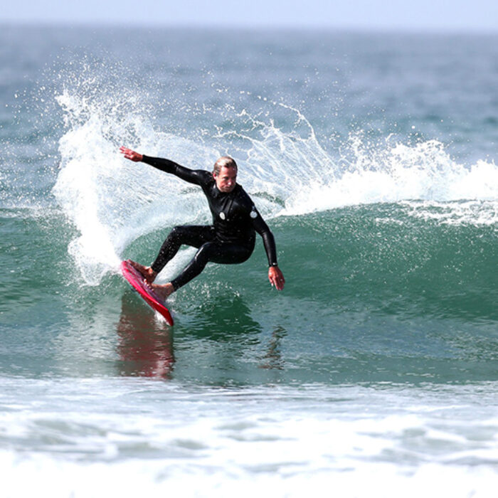 Colin McPhillips rides a wave on a Gerry Lopez board