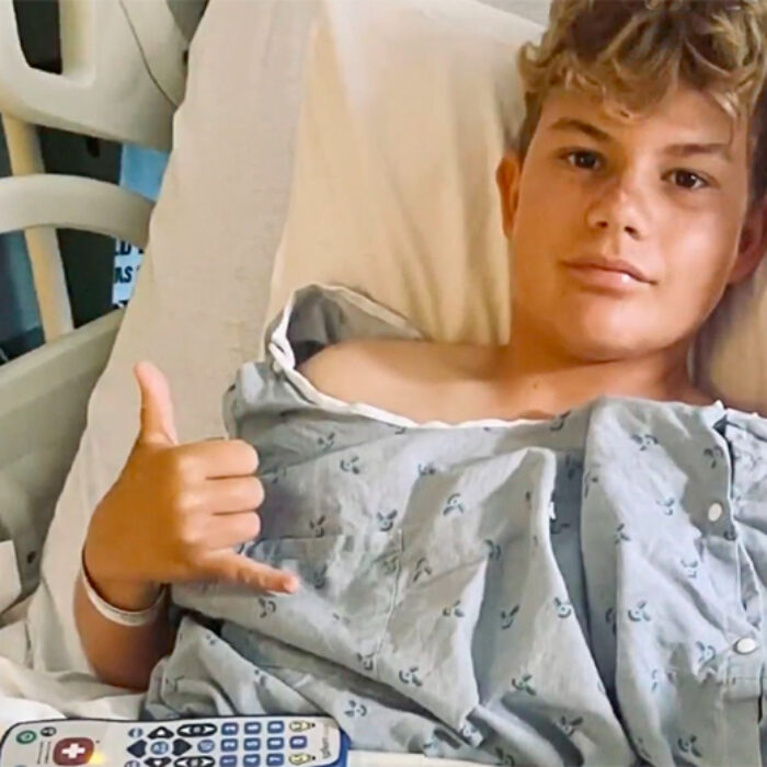 Parker Blanchette in a hospital bed after getting bitten by a shark