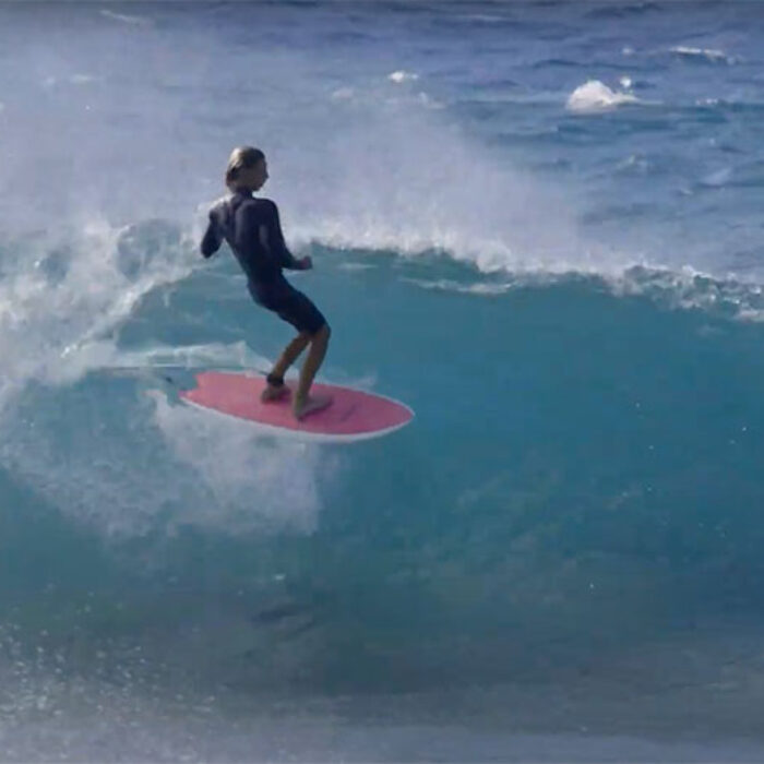 Tosh Tudor surfing