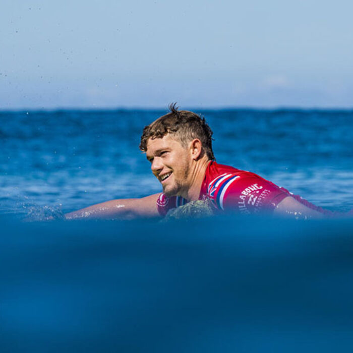 John John Florence paddling out to a WSL event