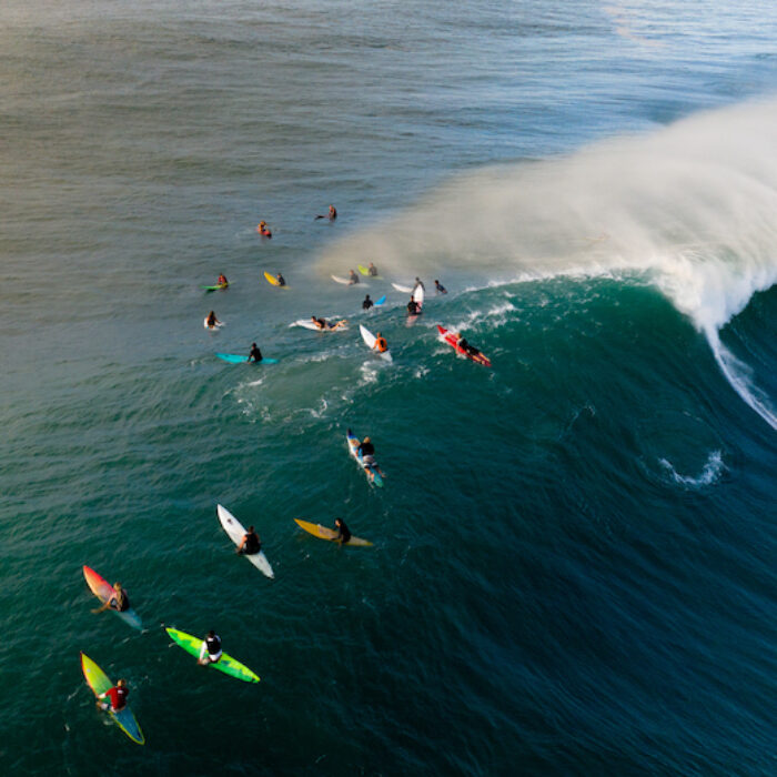 surfers at waimea bay, HI