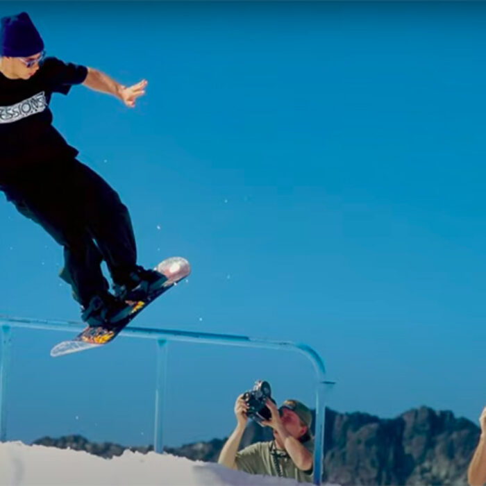 Jamie Lynn rides a rail on a sowboard