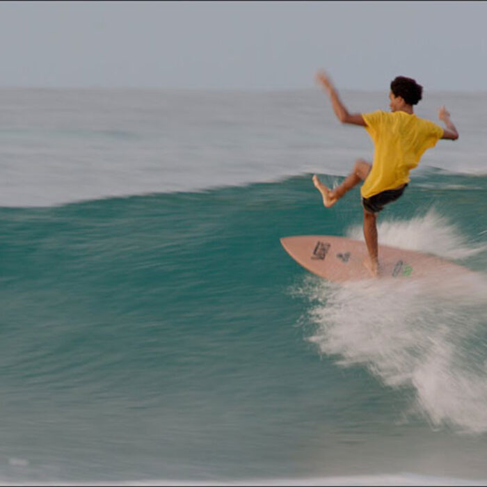 Mikey February surfing