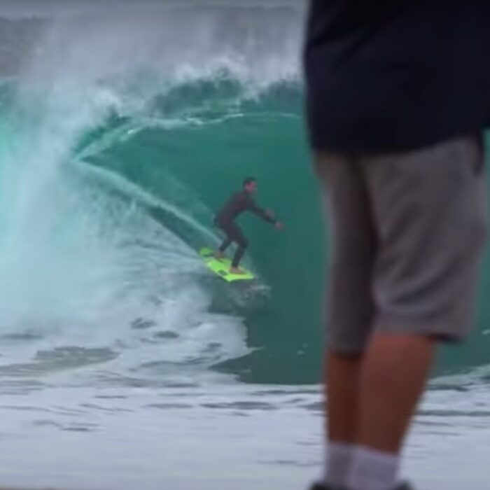 a surfer in a barrel at the wedge