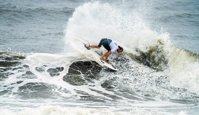 Owen Wright makes a turn on his surfboard during the Olympics in Japan