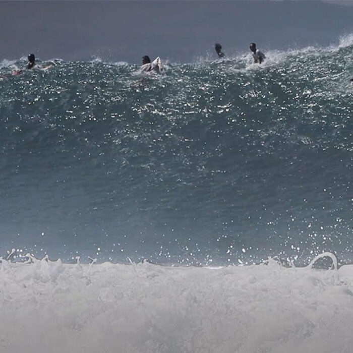 A giant set wave runs through Keramas in Bali