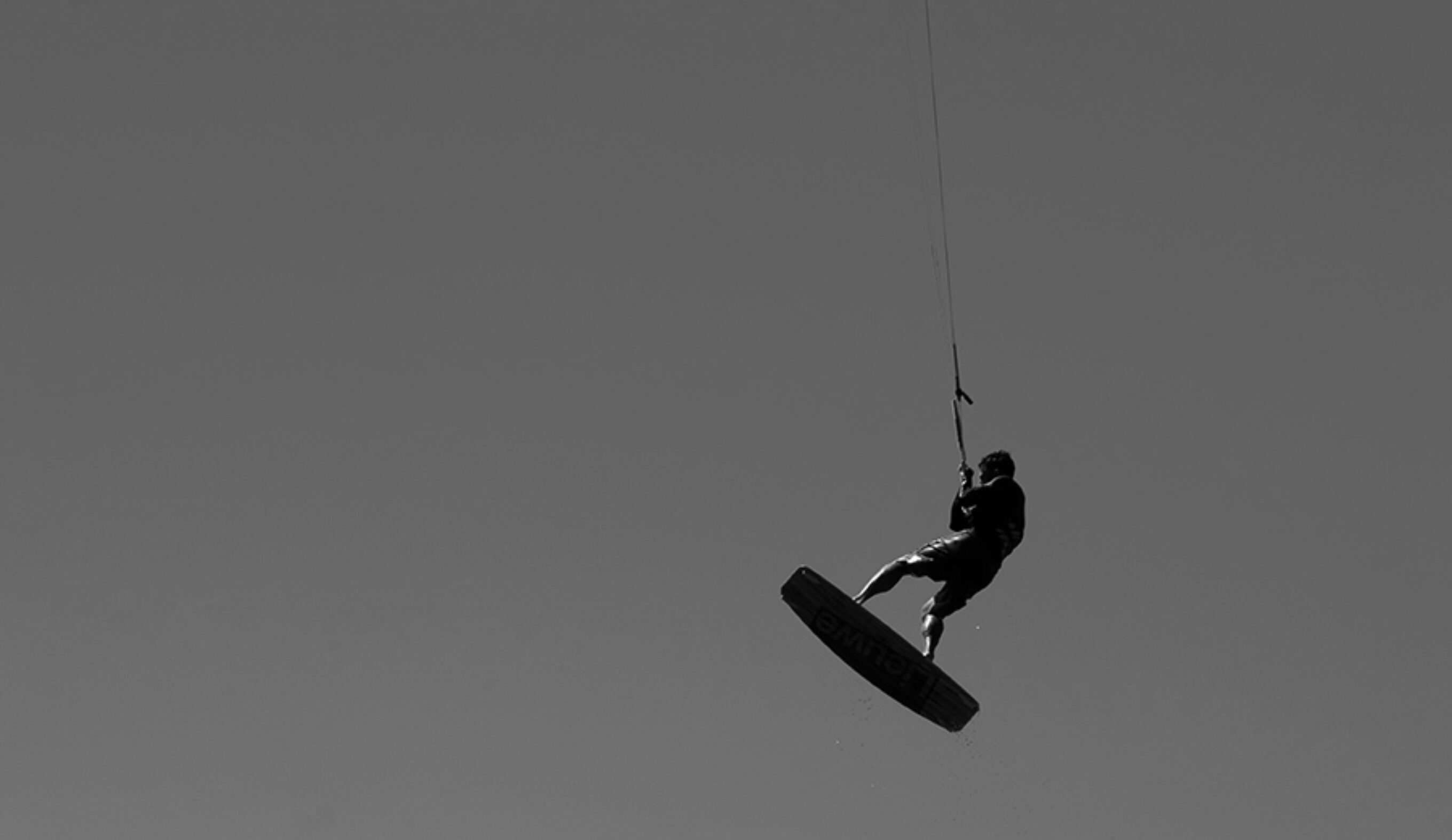 A kitesurfer gets air