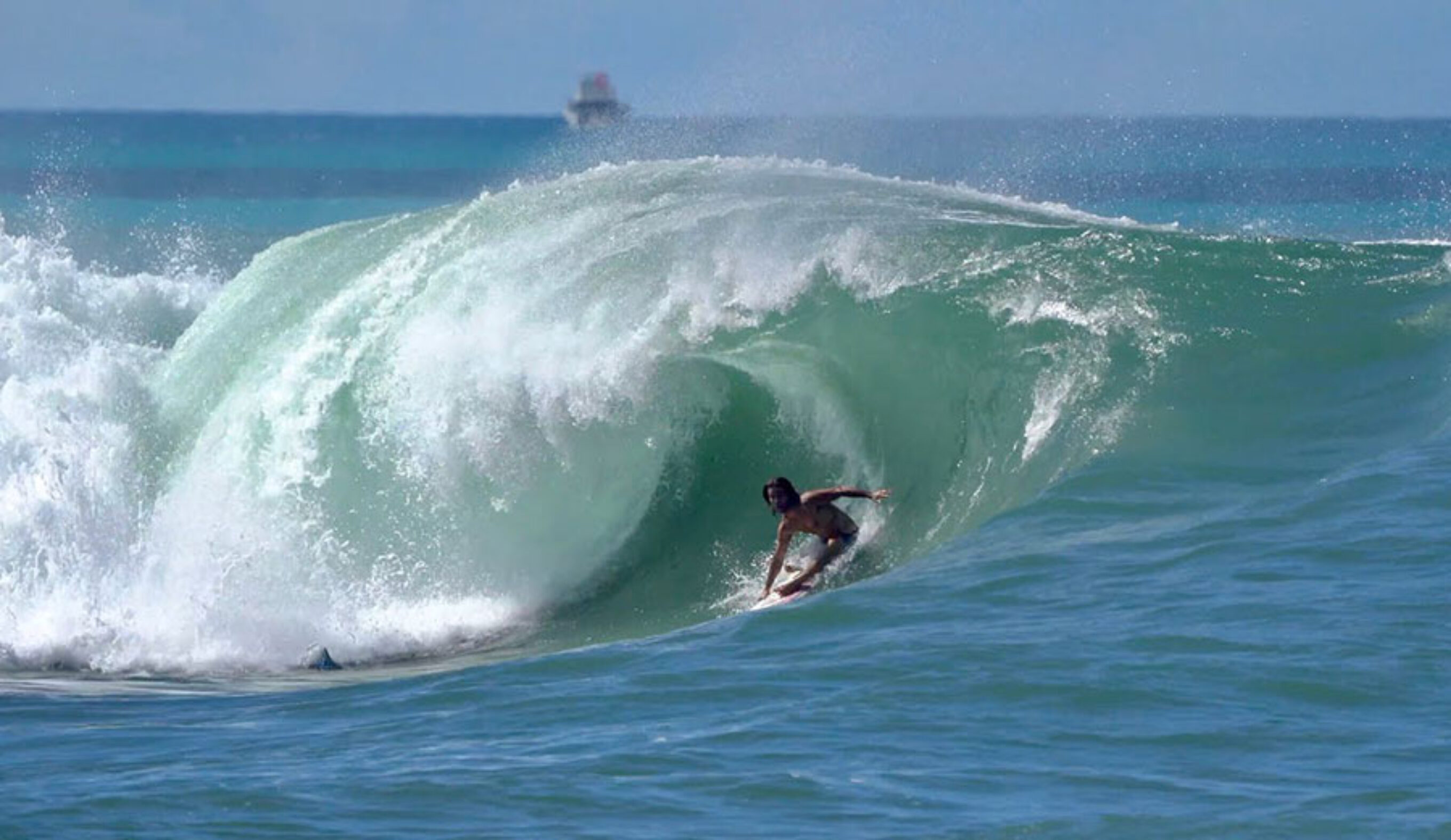 Mason Ho surfing Ala Moana Bowls