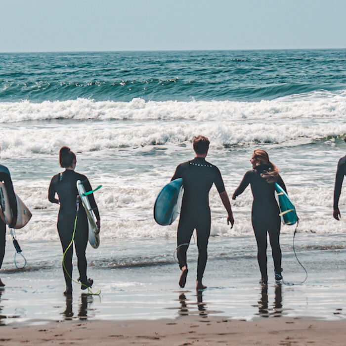 surfers walking into the ocean at Ocean Beach san francisco