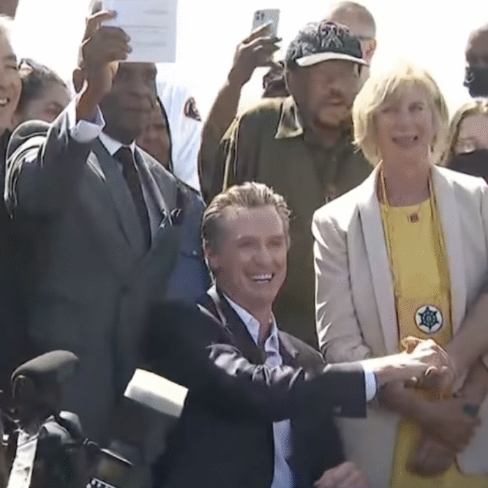 gavin newsom shaking anthony bruce's hand
