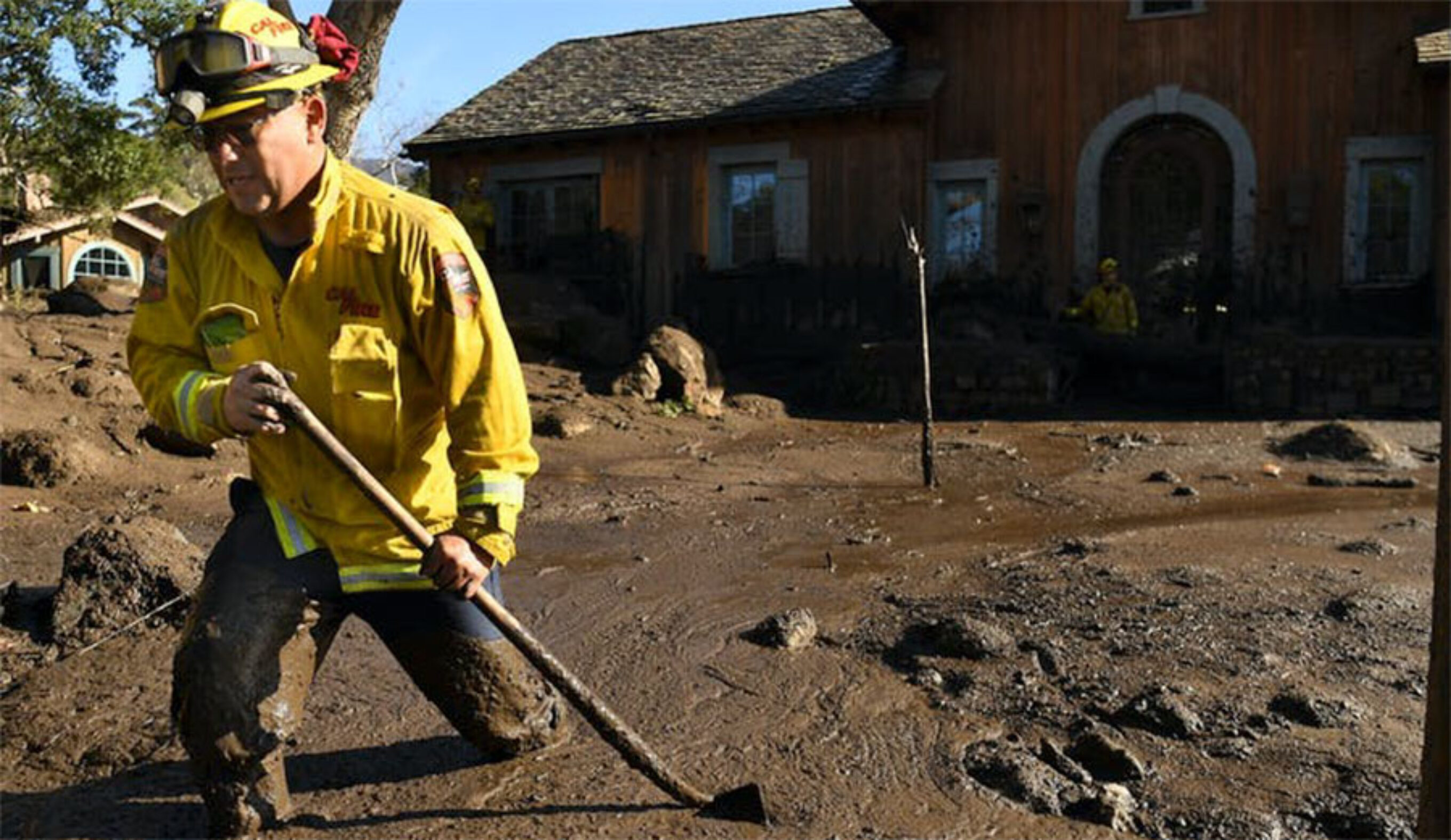 firefighter checking mudslide home