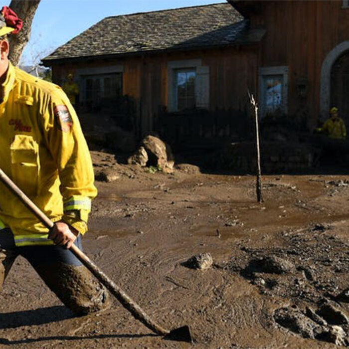 firefighter checking mudslide home